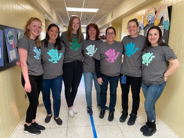 teachers dressed in matching t-shirts
