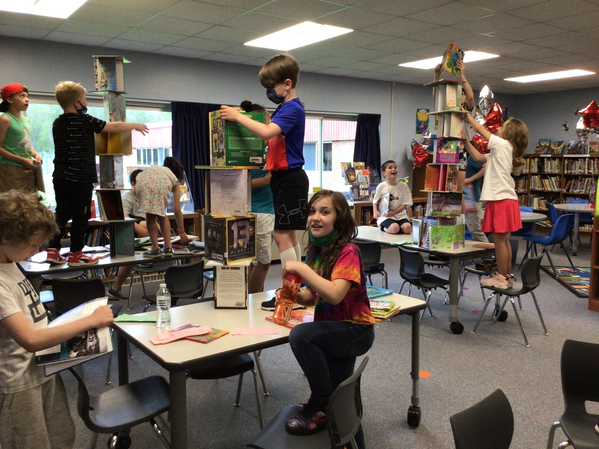 students doing building activity in the library